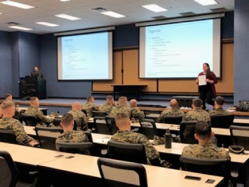 Administrator explaining PeBL trial to Marines